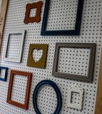 Color infused masterpiece of an eclectic gallery wall of picture frames in many styles and sizes in sets of 3, 5,7, 10, and 15