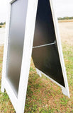 Charming distressed white sidewalk chalkboard sign with a reclaimed coastal feel, Boutique standing easel sandwich board 38x25 inches