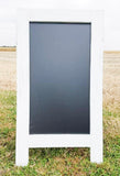 Charming distressed white sidewalk chalkboard sign with a reclaimed coastal feel, Boutique standing easel sandwich board 38x25 inches