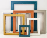 Color infused masterpiece of an eclectic gallery wall of picture frames in many styles and sizes in sets of 3, 5,7, 10, and 15