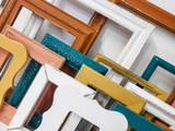 Captivating collection of mixed picture frames to curate a modern lake side cabin gallery wall in different sizes and styles.