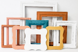 Captivating collection of mixed picture frames to curate a modern lake side cabin gallery wall in different sizes and styles.