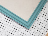 Serene lighter turquoise wall mounted bulletin with a neutral linen fabric, Available in Modern, Traditional, or Ornate Style of Frame and Small to Large Size, Agave
