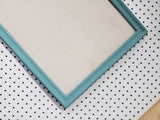 Serene lighter turquoise wall mounted bulletin with a neutral linen fabric, Available in Modern, Traditional, or Ornate Style of Frame and Small to Large Size, Agave