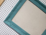 Serene lighter turquoise wall mounted bulletin with a neutral linen fabric, Available in Modern, Traditional, or Ornate Style of Frame and Small to Large Size, Agave