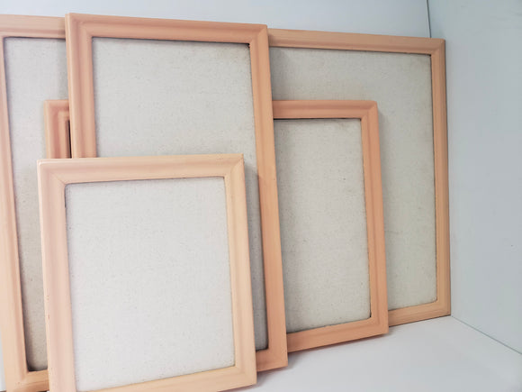 Fresh peach framed cork board for office, playroom, or girl's bedroom with a neutral linen fabric, Available in Modern, Traditional, or Ornate Frame Style in small to large sizes.