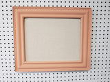 Fresh peach framed cork board for office, playroom, or girl's bedroom with a neutral linen fabric, Available in Modern, Traditional, or Ornate Frame Style in small to large sizes.