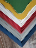 Multiple cheerful primary color interesting picture frames for a gallery wall in Red, blue, green, yellow, and white vibrant shades
