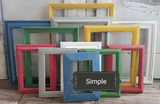 Multiple cheerful primary color interesting picture frames for a gallery wall in Red, blue, green, yellow, and white vibrant shades