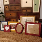 Multiple cheerful primary color interesting picture frames for a gallery wall in Red, blue, green, yellow, and white vibrant shades