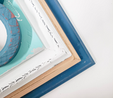 Serene coastal mismatched, decorative wall frames with a beachy vibe for an eclectic gallery wall