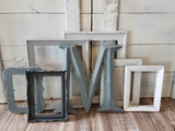 A mix and match set of vintage, shades of gray picture frames for a gallery wall, Assorted grey ombre photo frame wall collage for family memories