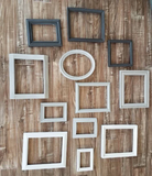 A mix and match set of vintage, shades of gray picture frames for a gallery wall, Assorted grey ombre photo frame wall collage for family memories